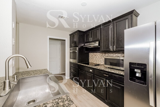 Building Photo - Turn the key. Enter. Smile. Repeat every day!