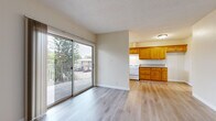 Located at 256 W Verdugo Ave in Burbank, CA, this one-bedroom, one-bathroom unit offers a practical and comfortable layout across a single floor. The open living area features light wood-style flooring, neutral walls, and a textured ceiling, creating a bright and welcoming atmosphere. Large sliding glass doors lead out to a private balcony with views of mature trees, allowing natural light to fill the space throughout the day.

The kitchen is well-appointed with warm honey-toned wood cabinetry, granite-style countertops, a white gas range, and ample upper and lower storage. It connects seamlessly to the living area, supporting an open flow ideal for everyday living. Light wood-style flooring continues through the kitchen and hallway, tying the common areas together cohesively.

The bedroom is comfortably sized, featuring plush wall-to-wall carpet, a ceiling fan with light fixture, a window for natural light, and a dedicated closet with sliding panel doors and a built-in hanging rod for convenient storage.

The bathroom includes a full tub-and-shower combination with chrome fixtures and clean white surround walls, offering a simple and functional design. Overall, the unit presents a well-maintained, efficiently organized living space in a convenient Burbank location.