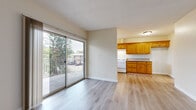 Located at 256 W Verdugo Ave in Burbank, CA, this one-bedroom, one-bathroom unit offers a practical and comfortable layout across a single floor. The open living area features light wood-style flooring, neutral walls, and a textured ceiling, creating a bright and welcoming atmosphere. Large sliding glass doors lead out to a private balcony with views of mature trees, allowing natural light to fill the space throughout the day.

The kitchen is well-appointed with warm honey-toned wood cabinetry, granite-style countertops, a white gas range, and ample upper and lower storage. It connects seamlessly to the living area, supporting an open flow ideal for everyday living. Light wood-style flooring continues through the kitchen and hallway, tying the common areas together cohesively.

The bedroom is comfortably sized, featuring plush wall-to-wall carpet, a ceiling fan with light fixture, a window for natural light, and a dedicated closet with sliding panel doors and a built-in hanging rod for convenient storage.

The bathroom includes a full tub-and-shower combination with chrome fixtures and clean white surround walls, offering a simple and functional design. Overall, the unit presents a well-maintained, efficiently organized living space in a convenient Burbank location.