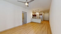 Located on Holm Road in San Antonio, TX, this single-story, 3-bedroom, 2-bathroom home offers a well-designed open-concept layout that maximizes functionality and flow. The living area features light wood-look flooring and a ceiling fan, creating a bright, comfortable atmosphere that connects seamlessly to the kitchen. The kitchen is a standout feature, outfitted with rich dark wood cabinetry, granite-look countertops, a central island with a sink, pendant lighting, and a full suite of stainless steel appliances including a refrigerator, range, and microwave. A hallway with double-panel closet doors provides additional storage and leads to the private bedroom wing. Each of the three bedrooms is carpeted, fitted with a ceiling fan, and receives natural light through large windows with blinds. The primary bedroom connects to a dedicated walk-in closet with wire shelving and to a full bathroom featuring a dark wood double vanity with granite countertops and wood-look flooring. A second walk-in closet and an additional bathroom serve the remaining bedrooms. A dedicated laundry area and additional closet space round out the practical offerings of this well-appointed San Antonio home.