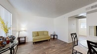 Located on W Camelback Rd in Phoenix, Arizona, this one-bedroom, one-bathroom unit offers a compact and efficiently designed single-floor layout. Throughout the space, warm wood-style flooring creates a cohesive and inviting atmosphere, complemented by crisp white walls and textured ceilings.

The living room is a comfortable, well-proportioned space featuring a window fitted with vertical blinds that allows natural light to filter in. The open feel of the room makes it versatile for various furniture arrangements. Adjacent to the living area, the dining room provides a dedicated space for meals, with a pass-through opening that connects to the kitchen, enhancing the sense of openness and functionality between the two areas.

The bedroom is a bright, private retreat with its own window dressed in vertical blinds, offering a quiet space with natural light and clean, neutral finishes. The full bathroom features a tub-shower combination, toilet, and a single-sink vanity, all finished in white with wood-style flooring that mirrors the rest of the unit.

Overall, this unit presents a clean, functional design with consistent finishes throughout, making efficient use of its intimate footprint. Its straightforward layout and neutral palette offer a versatile canvas well-suited for comfortable everyday living in the heart of Phoenix.