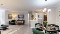 Located on Gables Dr NE in Atlanta's 30319 zip code, this single-story residence offers a thoughtfully designed open-concept layout finished with light wood-style flooring, crown molding, and neutral tones throughout the main living areas. The living room is generously proportioned, bathed in natural light from large windows, and flows seamlessly into both the dining area and kitchen, creating a cohesive and functional space ideal for everyday living and entertaining.

The kitchen features white cabinetry, light quartz countertops, subway tile backsplash, and stainless steel appliances including a refrigerator, electric range, and microwave. A peninsula with a sink provides additional prep space and connects directly to the open layout. An in-unit laundry area with a full-size washer and dryer is conveniently accessible from the kitchen.

The dedicated dining area is defined by wainscoting and an overhead chandelier, lending a refined touch. The bedroom is carpeted for comfort and includes a ceiling fan and closet. The bathroom is clean and functional, featuring a full tub-shower combination with tiled surround. Overall, the space presents a comfortable, well-finished environment in a desirable Atlanta location.
