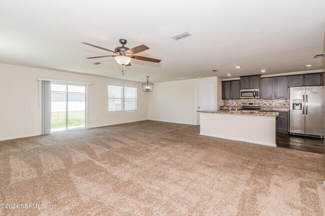 Building Photo - 15697 Saddled Charger Dr