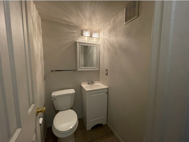 Half bathroom on the main floor, same floor as the kitchen - 670 Winona Ct