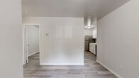 Located at 340 Dixie Hills Circle in Atlanta, GA, this efficient one-bedroom, one-bathroom unit offers a well-organized single-floor layout designed to maximize every square foot. Throughout the space, light gray luxury vinyl plank flooring provides a clean, modern foundation that ties each room together cohesively.

The kitchen is outfitted with white cabinetry, subway tile backsplash, light countertops, and stainless steel appliances including a full-size refrigerator. A window with a blind lets in natural light, brightening the workspace and creating an open, airy feel.

The bedroom is a comfortable and quiet retreat, featuring a window that frames a lush, green outdoor view, filling the room with soft natural light. A dedicated closet provides practical storage, and the neutral wall tones keep the space feeling calm and versatile.

The bathroom is clean and functional, centered around a full soaking tub with a tiled surround. A window above the tub allows for natural ventilation and additional light.

Neutral gray walls throughout lend a consistent, move-in-ready aesthetic. Clean white trim and panel-style doors complete the interior detailing, giving the space a tidy, updated character. This unit is a practical and well-appointed option for those seeking efficient living in Atlanta.