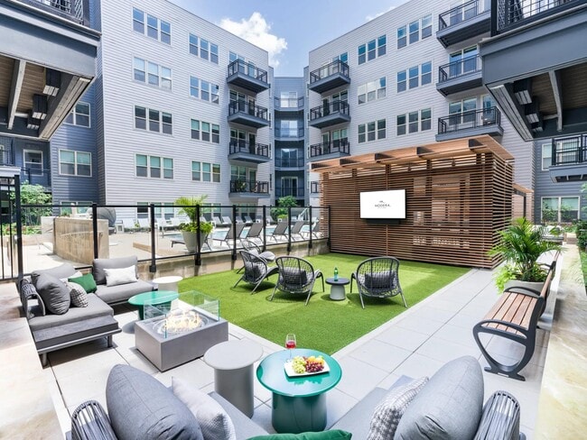 Whether you’re streaming the game or sipping wine by the fire, this outdoor lounge is your backyard escape—perfect for winding down after a Metro commute or gathering with neighbors. - Modera Falls Church