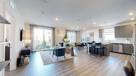 This well-appointed 2-bedroom, 4-bathroom residence in Lawrence Township, NJ offers a thoughtfully designed single-floor layout with contemporary finishes throughout. The open-concept living, dining, and kitchen area serves as the heart of the home, featuring wide-plank hardwood-style flooring, recessed lighting, and expansive windows and sliding glass doors that flood the space with natural light and provide access to an outdoor area. The living room offers generous proportions, ideal for both relaxing and entertaining.

The kitchen is outfitted with sleek gray flat-front cabinetry, white quartz countertops, a classic subway tile backsplash, stainless steel appliances, and a central island with bar seating — blending functionality with modern style. A dedicated dining area connects seamlessly to both the kitchen and living room.

Both bedrooms are bright and comfortably sized, each with large windows and ceiling fans. The primary bedroom features its own en-suite bathroom, which includes a wood-toned vanity with a quartz countertop, a lighted mirror, and a walk-in glass-enclosed shower with wood-look tile surround. Additional bathrooms maintain the same refined aesthetic with quality tile and clean finishes. Multiple closets and hallways enhance storage and circulation throughout.