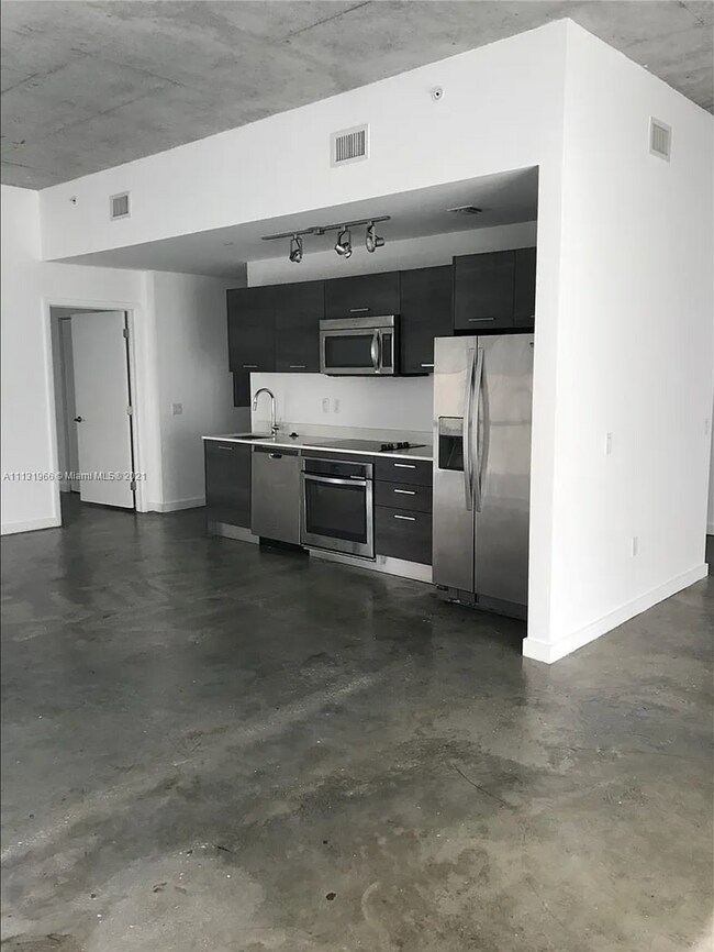 Split bedroom floor plan allows for privacy between bedrooms and a shared kitchen space - 151 SE 1st St