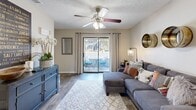 This charming 730 square foot apartment in Daytona Beach, Florida offers a perfect blend of comfort and style. The single-story layout comprises two bedrooms, two bathrooms, a kitchen, living room, and closet space. The primary bedroom, at 140 square feet, provides ample space for relaxation.

The living area is inviting, featuring a comfortable sectional sofa, stylish area rug, and ceiling fan. Large sliding glass doors flood the space with natural light and offer access to an outdoor patio. The modern kitchen boasts sleek appliances, white cabinetry, and a spacious granite countertop, ideal for meal preparation and casual dining.

Both bedrooms are well-appointed with plush carpeting, ceiling fans, and large windows. The bathrooms feature clean, white fixtures and contemporary finishes. Throughout the apartment, you'll find thoughtful decorative touches, including artwork, mirrors, and accent pieces that create a cohesive and inviting atmosphere.

The apartment's efficient design maximizes the use of space, making it feel larger than its 730 square feet. With its blend of functionality and style, this Daytona Beach apartment offers a comfortable living experience in a prime location.