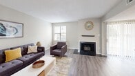 Located at 1669 Randolph Pl in Memphis, TN, this two-story home offers 2 bedrooms and 3 bathrooms thoughtfully distributed across two equally sized floors. The main level features an open living and dining area anchored by a classic fireplace with a tiled surround and wood mantle, complemented by light hardwood-style flooring and neutral tones throughout. The galley-style kitchen is well-appointed with white cabinetry, stainless steel appliances, light countertops, and hardwood-style flooring, flowing seamlessly toward the dining area with natural light from nearby windows. A dedicated workspace area off the living room adds functional versatility to the main floor. The bathrooms feature granite-style countertops, white vanity cabinetry, and clean tile work, with one bath offering a full soaking tub and shower combination. Upstairs, the generously sized primary bedroom features plush carpeting, a dedicated closet, and a window with exterior views, while the second bedroom also offers carpeted flooring, natural light, and ample closet storage. Two dedicated closets provide practical storage throughout. The home's consistent use of soft neutral palettes, updated finishes, and a cohesive design aesthetic creates a comfortable and functional living environment.
