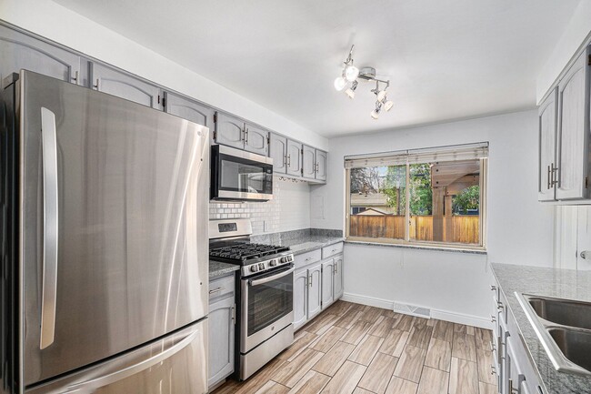 Building Photo - Updated Five-Bedroom Brick Ranch in the He...