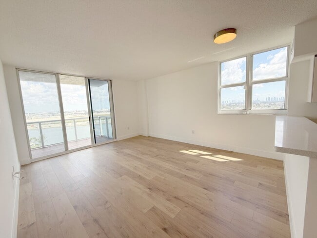 Photo - Rare 2/2 Corner Penthouse with Panoramic Lagoon Views from Every Room – Available Now!