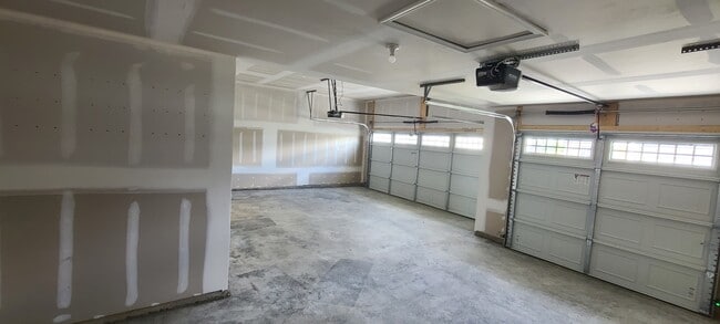 Three car garage gives ample space for extra storage along with all the cars your family owns. - 8985 Hawk Hill Way