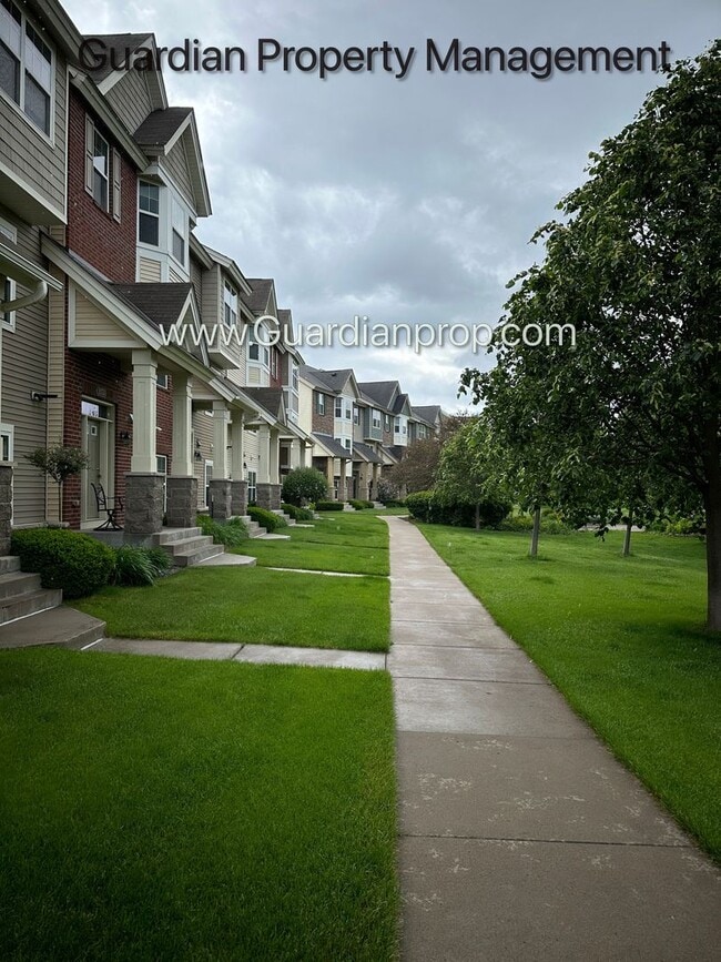 Building Photo - Pet Free Champlin Town Home, 3.5 Baths, 2 Car Garage, Dishwasher, Balcony, Available end of April
