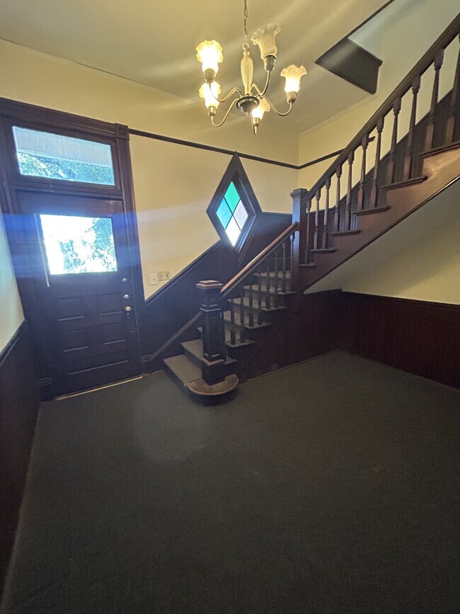 First floor foyer with staircase leading to second floor apartment. - 1118 25th St