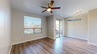 Located in Glendale, Arizona, this two-bedroom, two-bathroom residence offers a thoughtfully designed single-level layout that maximizes functionality and comfort. Throughout the home, wood-style flooring adds warmth and visual continuity, while neutral tones on the walls create a clean, modern aesthetic.

The open-concept kitchen and living area serves as the heart of the home. The kitchen is equipped with rich, dark-wood cabinetry, granite countertops, stainless steel appliances including a dishwasher, gas range, refrigerator, and microwave, and a peninsula that provides additional prep and seating space. A ceiling fan in the adjoining living area keeps the space comfortable, while a sliding glass door opens to a private balcony, bringing in natural light and outdoor views.

The primary bedroom is generously sized, featuring a ceiling fan, a large window, and direct access to one of the two bathrooms. The bathrooms are finished with granite vanity tops, dark wood cabinetry, and wood-style tile flooring. One bathroom includes a full bathtub-shower combination. The second bedroom is well-proportioned, with a ceiling fan and a bright window. A connecting hallway provides access to both bedrooms and bathrooms, completing this efficiently designed and move-in ready home.