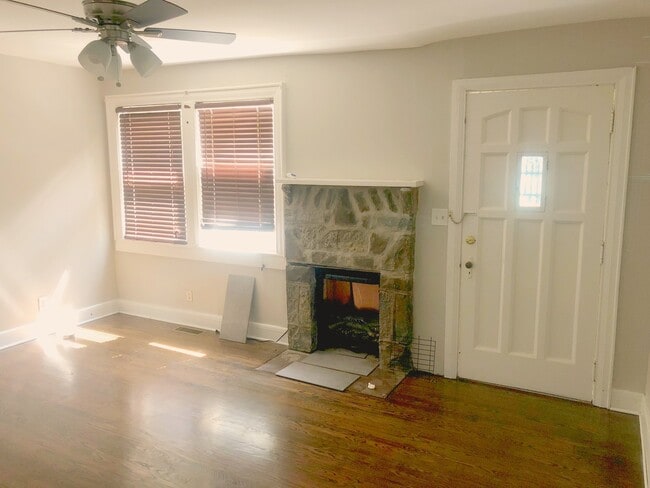 Charming living room with vintage stone fireplace - 2200 Claylick Road