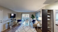 This thoughtfully designed apartment in Roseville, California offers a comfortable and modern single-floor layout. The living room serves as the heart of the unit, featuring rich hardwood-style flooring, a sliding glass door that opens to a private balcony with outdoor views, and abundant natural light. The space is anchored by neutral tones that create a warm, inviting ambiance throughout.

The kitchen is well-appointed with dark espresso cabinetry, granite countertops, a stainless steel sink, and a dishwasher. Adjacent to the kitchen, the dining area includes a ceiling fan and is framed by a mirrored wall panel that adds depth and brightness to the space.

The primary bedroom offers plush carpeting, a walk-in closet with built-in shelving, and a serene atmosphere ideal for rest. A second bedroom is filled with natural light from dual windows and also features carpeted flooring, making it equally suited as a guest room or home office. A dedicated workspace nook within the second bedroom provides added flexibility.

The full bathroom is finished with a granite-topped dark vanity, a large mirror, and a shower-tub combination. A separate laundry area with washer hookups adds everyday convenience. Throughout the unit, consistent finishes and cohesive design elements contribute to a polished, functional living environment.
