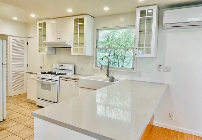 Kitchen with quartz pass-through to dining area - 12114 Ohio Ave