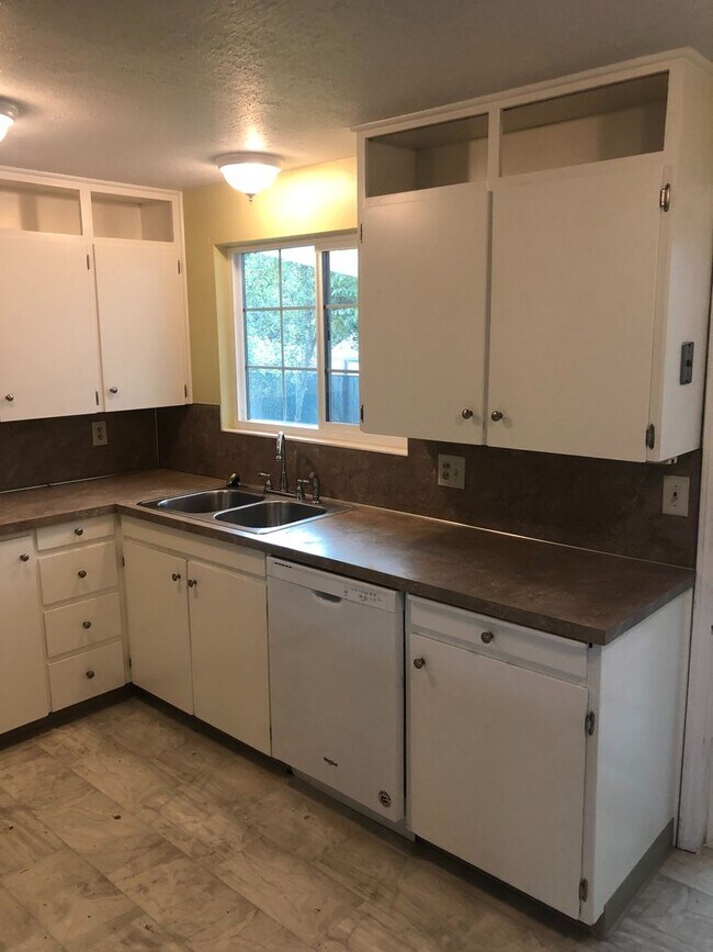 Building Photo - Updated Four Bedroom Home with New Lawn an...