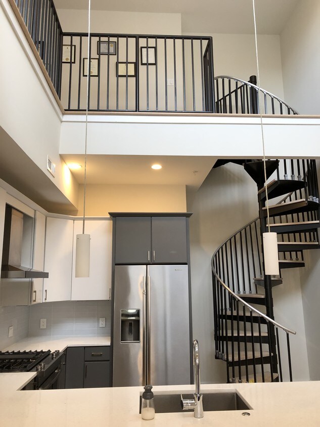 Sleek spiral staircase from main floor to sec - 3035 15th St NW