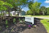 This contemporary apartment in Cedar Rapids offers 740 square feet of well-designed living space. The open floor plan seamlessly integrates the kitchen and living areas, creating a spacious feel. The kitchen boasts modern white cabinetry, black appliances, and ample counter space, perfect for culinary enthusiasts.

The two bedrooms feature plush carpeting and generous closet space, with the primary bedroom measuring 150 square feet. Large windows in both rooms provide natural light and a bright atmosphere. The bathroom is equipped with a tub-shower combination and a single vanity, offering functionality and style.

A standout feature is the in-unit laundry room, adding convenience to daily life. The apartment's flooring alternates between sleek hardwood in the main living areas and soft carpeting in the bedrooms, enhancing comfort and aesthetics.

Throughout the space, recessed lighting and ceiling fans contribute to the modern ambiance. The neutral color palette and clean lines create a versatile backdrop for various decor styles. With its thoughtful layout and contemporary finishes, this apartment presents an attractive option for those seeking a comfortable and efficient living space in Cedar Rapids.