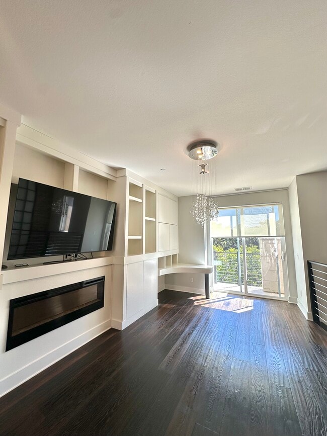 Family room on 2nd Story with Built in Cabinetry - 7870 Civita Blvd