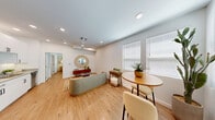 Located at 3125 N Boulder Hwy in Henderson, Nevada, this one-bedroom, one-bathroom unit offers a thoughtfully designed layout across a single floor. Light wood-tone flooring runs throughout the space, creating a warm and cohesive aesthetic from room to room.

The open-concept living and dining area is bright and welcoming, featuring recessed lighting, a ceiling fan, and large windows with white blinds that allow natural light to fill the space. A compact dining area accommodates a round table and seating, while the living area provides comfortable room for a sofa and accent furnishings.

The kitchen is efficiently designed with crisp white shaker-style cabinetry extending to the ceiling, offering generous storage. Stainless steel appliances — including a gas range, over-the-range microwave, refrigerator, and dishwasher — complement the neutral countertops and clean, modern aesthetic.

The bedroom is a well-proportioned retreat with a ceiling fan, a large window for natural light, and a dedicated closet for storage. Its neutral walls and wood flooring continue the calm, cohesive tone of the unit.

The bathroom features a full tub-shower combination with white tile surround, a curved shower rod, and clean, simple finishes. The overall ambiance of the unit is light, modern, and functional — ideal for comfortable everyday living.