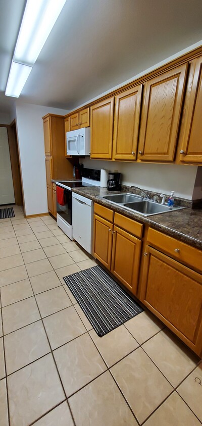 Kitchen -Fridge, stove , Microwave, dishwasher plus full kitchen - 312 S 1st St