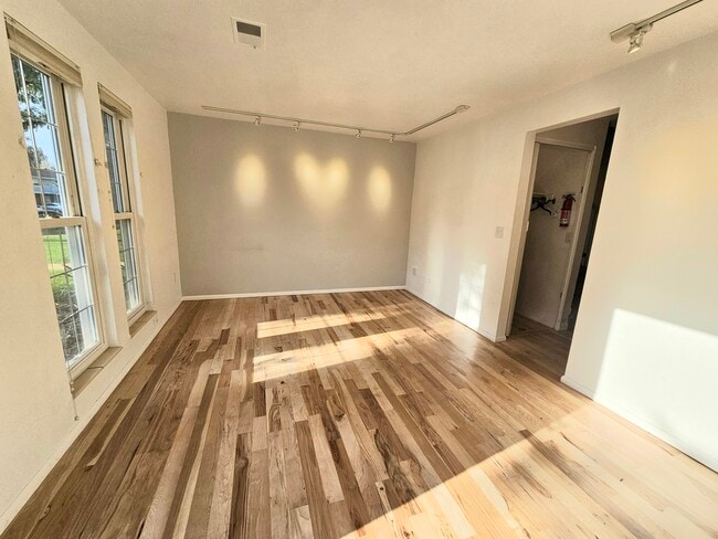 Living room with accent light gray wall - 3680 Quail St