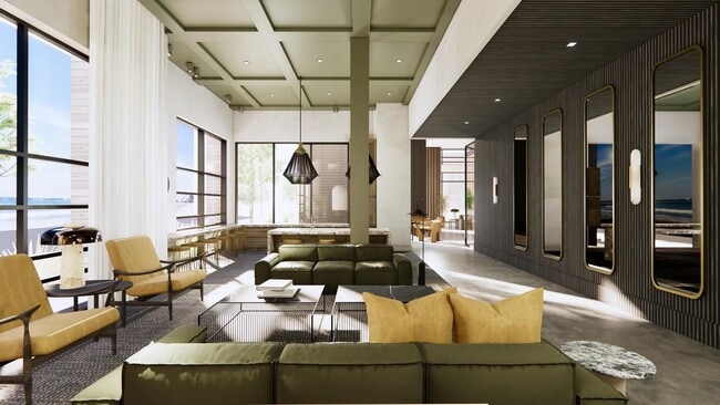 Expansive clubroom with gathering space and comfortable seating. - Modera Revere Beach