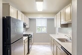 Located at 25 School Dr in Gaithersburg, Maryland, this single-floor residence offers four bedrooms, one bathroom, and a dedicated kitchen within a thoughtfully arranged layout. The neutral gray color palette and clean white trim create a cohesive, modern aesthetic throughout the unit.

The generously sized primary bedroom stands out as the largest room in the home, featuring plush wall-to-wall carpeting, a broad window that frames lush greenery outside, and ample floor space to accommodate a variety of furniture arrangements. The additional three bedrooms are similarly finished with soft carpeting and neutral walls; several include closets and windows that bring in natural light, giving each room a bright and comfortable feel.

The kitchen is efficiently designed with white cabinetry, stone-look countertops, tile flooring, and a window overlooking the outdoors — offering both functionality and a pleasant environment for meal preparation. The full bathroom features a clean, white tiled tub-shower combination, maintaining the home's consistent, understated aesthetic.

Throughout the residence, ceiling vents, built-in thermostats, and well-placed electrical outlets reflect practical, move-in-ready infrastructure. The single-level floor plan ensures easy navigation between all rooms, making this a functional and comfortable home in the heart of Gaithersburg.