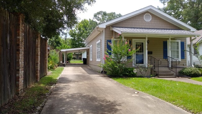 Driveway with one car carport - 112 N Division St