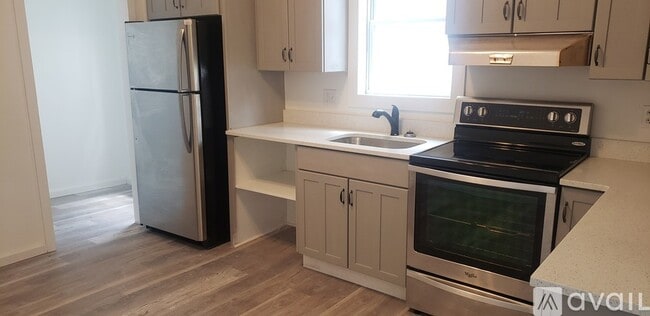 Kitchen with stainless steel fridge and stove - 335 1st St