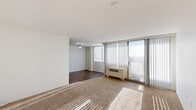 Located at 3701 Conshohocken Ave in Philadelphia, PA, this one-bedroom, one-bathroom unit offers a well-organized, functional layout across a single floor. The living room is bright and open, featuring large windows with vertical blinds that allow generous natural light to filter in, along with a sliding glass door that connects to an outdoor area. The living space features a combination of carpet and hardwood-style flooring, creating a comfortable and practical environment. A wall-mounted HVAC unit ensures year-round climate control. The kitchen is efficiently designed in an L-shaped layout, outfitted with white cabinetry, dark countertops, and white appliances including a gas range, dishwasher, and refrigerator. A flush-mounted overhead light and hardwood-style flooring complete the space. The spacious bedroom is carpeted and bathed in natural light through large windows with vertical blinds. It includes two closets—one a double-door closet—providing ample storage. The full bathroom features tile flooring, a white vanity with under-cabinet storage, a lighted mirror, and a shower-tub combination. Two additional closets throughout the unit offer convenient extra storage.