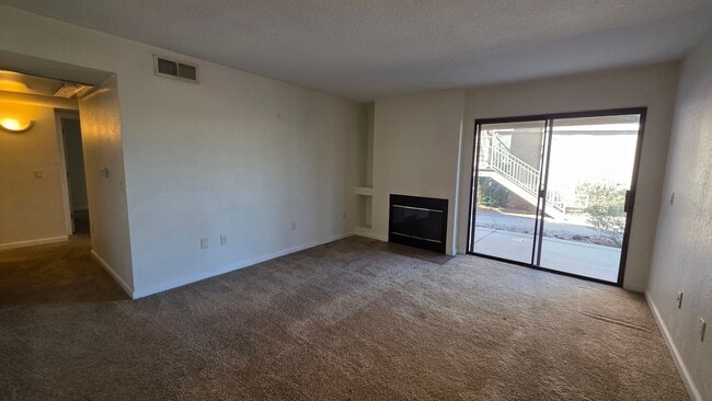 Building Photo - Take in mountain and desert views! First-level, two-bedroom, two-bath corner unit in Moonrise at ...