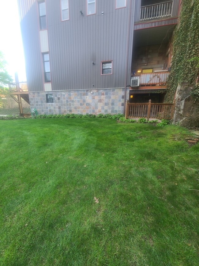 View of unit from side w/ Patio - 277 Bluff St