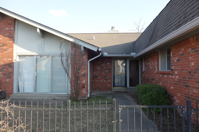 Gated front courtyard. - 3324 E 73rd St