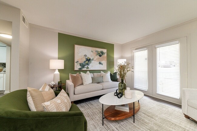 Spacious living room with hardwood-style flooring - Vetra Belle Meade