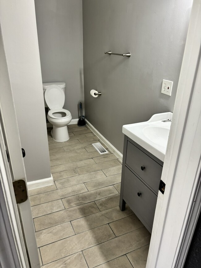 New flooring in bathroom - 2621 Arsenal St