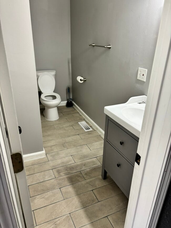 New flooring in bathroom - 2621 Arsenal St