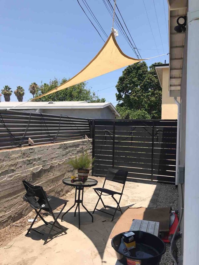 private covered patio space - 6403 Arlington Ave