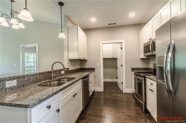 Kitchen and Laundry - 124 Foxden Dr