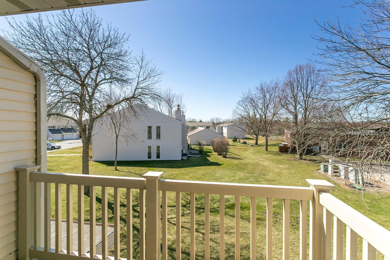 Yard view off the outside deck from Bedroom. - 32 Coventry Ln