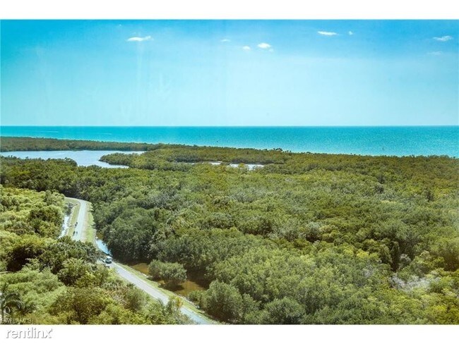 Foto del edificio - 2 br, 2 bath Condo - 7515 Pelican Bay Blvd.
