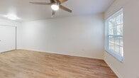 Located in Tarpon Springs, FL, this single-floor, one-bedroom, one-bathroom home offers a clean and functional layout designed to maximize every square foot. Light wood-style flooring flows seamlessly throughout the entire space, lending warmth and visual continuity from room to room.

The combined kitchen and living area forms the heart of the home. The kitchen is outfitted with dark gray cabinetry, white countertops, and a full suite of stainless steel appliances including a gas range, over-the-range microwave, and refrigerator. A peninsula counter provides additional workspace and naturally defines the boundary between the kitchen and the adjacent living area. The living room benefits from natural light through a window with blinds and is equipped with a ceiling fan with light fixture.

The bedroom is generously sized, featuring the same wood-style flooring, a ceiling fan, and a window that allows natural light to fill the space. Convenient access to a dedicated closet offers practical storage. The bathroom is clean and simply appointed, featuring a full tub and shower combo with white tile surround and chrome fixtures.

Throughout the home, white walls, consistent flooring, and ceiling fans create a bright, airy atmosphere well-suited to the warm Florida climate.