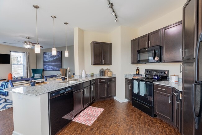 Fully Equipped Gourmet Kitchen with Black Appliances - Waterford at Southlands