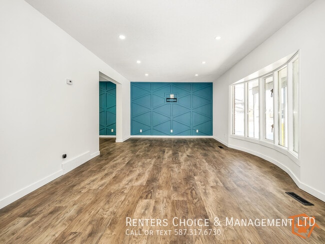 Building Photo - 2-storey Main Floor Suite with Driveway Pa...