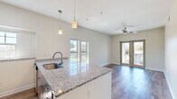 Step into a world of contemporary elegance and effortless living. This stunning Pensacola residence offers 3 bedrooms and 2 bathrooms within its efficiently designed 790 square feet. The heart of the home is a breathtaking open-concept kitchen and living area, where gleaming hardwood floors meet chic granite countertops and stainless steel appliances. Bathed in natural light from expansive windows, this space beckons for both relaxation and entertaining.

The primary bedroom, a generous 120 square feet, provides a serene retreat with ample space and a modern ceiling fan for comfort. French doors in one of the bedrooms open to a charming balcony, perfect for morning coffee or evening relaxation. The bathrooms showcase contemporary fixtures and finishes, including sleek vanities and tiled surroundings.

Throughout the home, stylish lighting fixtures and ceiling fans add both ambiance and functionality. The property's clean lines, neutral palette, and quality finishes create a canvas for your personal style. This low-maintenance, high-style home in Pensacola is not just a place to live, but a lifestyle to embrace. Your journey to modern, efficient living starts here.