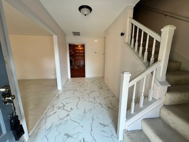 Building Photo - Step into this inviting, sunlit home where space and comfort blend seamlessly